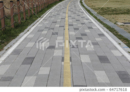 Beautiful scenery with brick road 64717618