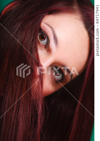 Face of attractive young woman. 64717941