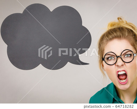 Angry business woman with speech bubble Angry business woman with speech bubble 64718282