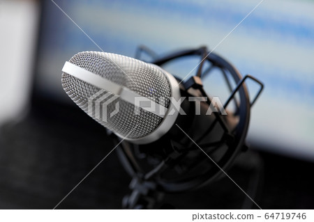 close up of microphone at recording studio 64719746