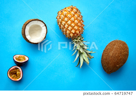 pineapple, passion fruit and coconut on blue 64719747