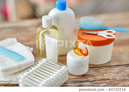 baby accessories for bathing on wooden table 64720316