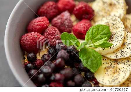 cereal breakfast with berries, banana and mint cereal breakfast with berries, banana and mint 64720317