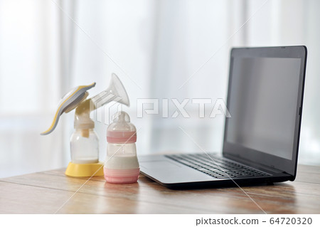 baby milk formula, breast pump and laptop baby milk formula, breast pump and laptop 64720320