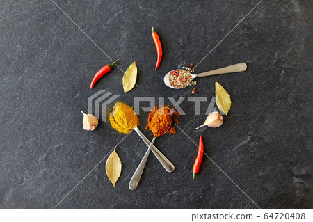 spices, chili pepper, bay leaf and garlic on stone spices, chili pepper, bay leaf and garlic on stone 64720408