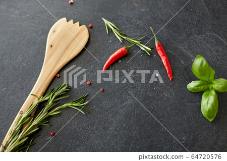 rosemary, basil and chili pepper on stone surface rosemary, basil and chili pepper on stone surface 64720576