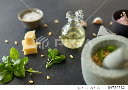 ingredients for basil pesto sauce on stone table ingredients for basil pesto sauce on stone table 64720582