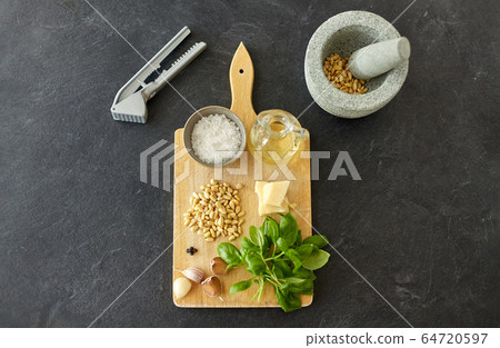 ingredients for basil pesto sauce on wooden board ingredients for basil pesto sauce on wooden board 64720597