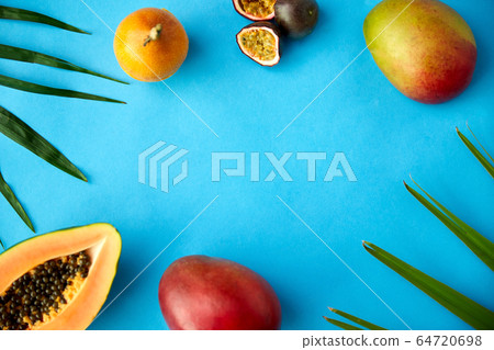 different exotic fruits on blue background 64720698