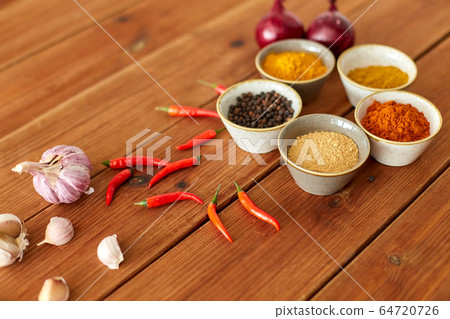 spices, onion, garlic and red hot chili peppers spices, onion, garlic and red hot chili peppers 64720726