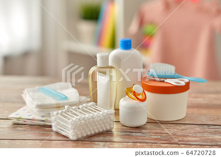 baby accessories for bathing on wooden table 64720728