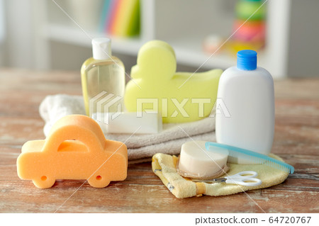baby accessories for bathing on wooden table 64720767