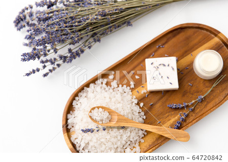 sea salt, lavender soap and moisturizer on tray 64720842