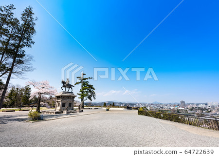 Statue of Masamune Date, equestrian statue overlooking the cherry blossoms and Sendai city 64722639