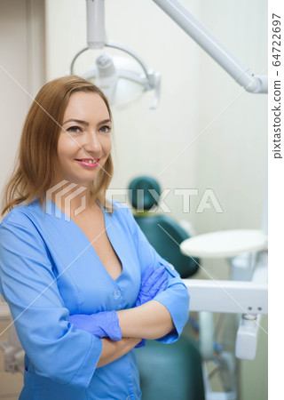 Portrait of modern dentist woman at work. Portrait of modern dentist woman at work. 64722697