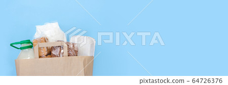 Food donations on blue background, top view with Food donations on blue background, top view with 64726376
