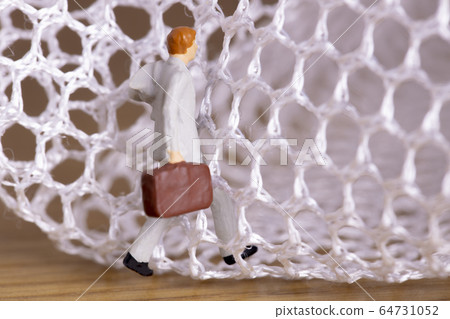 Businessman trying to get out of the mesh Businessman trying to get out of the mesh 64731052