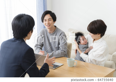 Businessman operating for a couple with infants Businessman operating for a couple with infants 64735640