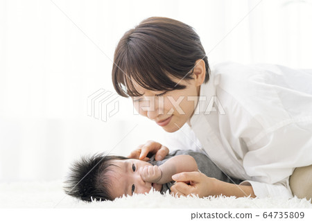Mother interacting with a three-month-old boy Mother interacting with a three-month-old boy 64735809