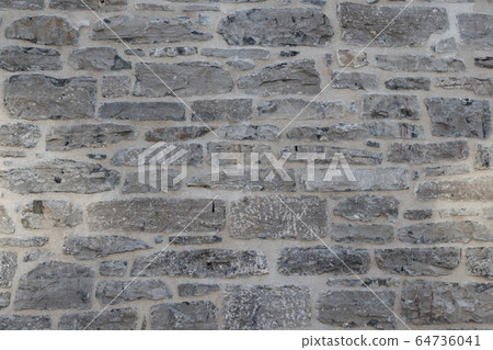 Old weathered granite stone wall textured natural background Old weathered granite stone wall textured natural background 64736041