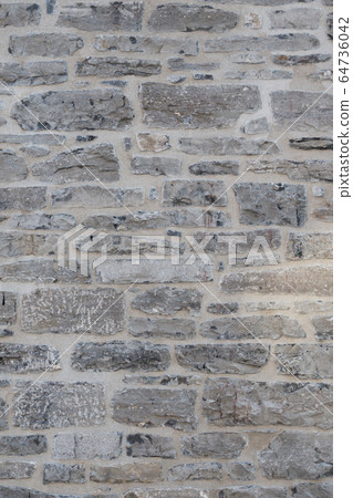 Old weathered granite stone wall textured natural background Old weathered granite stone wall textured natural background 64736042