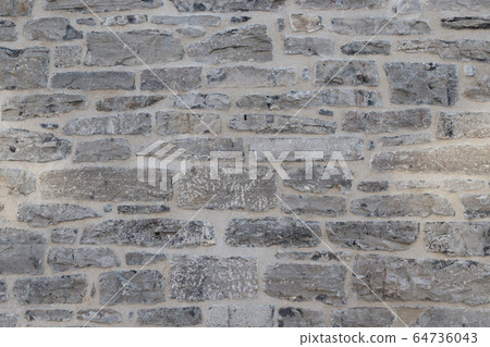 Old weathered granite stone wall textured natural background Old weathered granite stone wall textured natural background 64736043