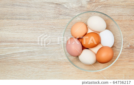 eggs of different colors from white to brown in a eggs of different colors from white to brown in a 64736217
