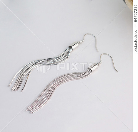 A pair of beautiful 925 sterling silver earrings  in tassel shape isolated   64737253