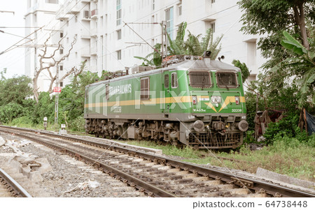 A high power electric WAG 9 locomotive loco engine wagon on rail tracks of Indian Railway. A high power electric WAG 9 locomotive loco engine wagon on rail tracks of Indian Railway. 64738448