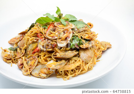 Stir fried noodles with clams and herbs, hot and Stir fried noodles with clams and herbs, hot and 64738815