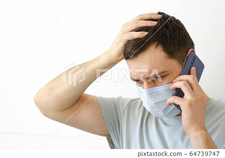 Coronavirus. Quarantine. A man solves work issues 64739747