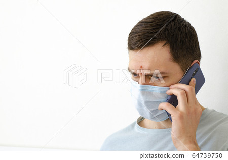 Coronavirus. Quarantine. A man solves work issues Coronavirus. Quarantine. A man solves work issues 64739750
