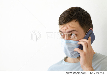 Coronavirus. Quarantine. A man solves work issues Coronavirus. Quarantine. A man solves work issues 64739751