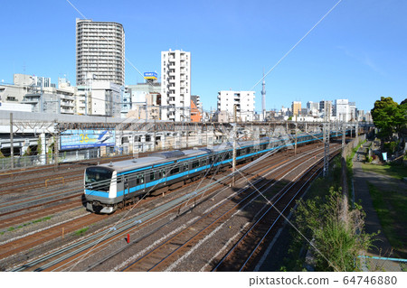 Keihin Tohoku Line (E233 series) and the streets of Negishi, Taito-ku seen from the Imizaka Overpass 64746880
