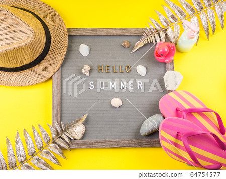 Hello summer text on letter board with seashells Hello summer text on letter board with seashells 64754577