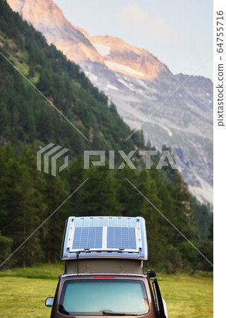 Mountain and forest scenery, car with open trunk. Mountain and forest scenery, car with open trunk. 64755716