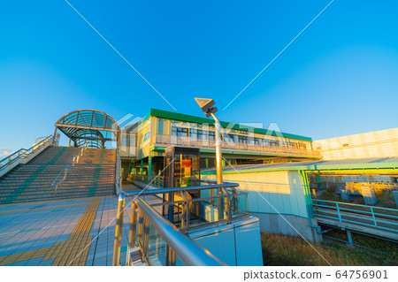 Fujisawa cityscape in Japan, with views of Rokukaibi-Omae Station bathing in the setting sun 64756901