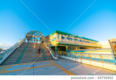 Fujisawa cityscape in Japan, with views of Rokukaibi-Omae Station bathing in the setting sun 64756902