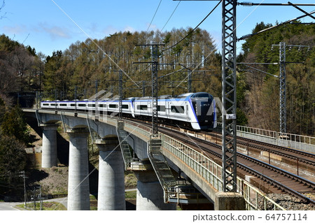 Fujimi-cho, Nagano Prefecture, E353 series express Azusa crossing the larch forest and standing river bridge Fujimi-cho, Nagano Prefecture, E353 series express Azusa crossing the larch forest and standing river bridge 64757114