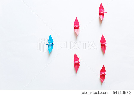 Image of physical distance consisting of paper cranes on a white background 64763620