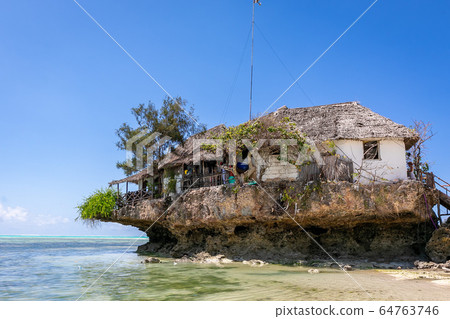 Exterior view of The Rock, a floating restaurant on the island of Zanzibar, Tanzania 64763746