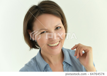 Portrait of beautiful young woman posing isolated 64764574