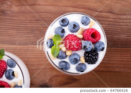 natural Greek yogurt and wild berries 64766426