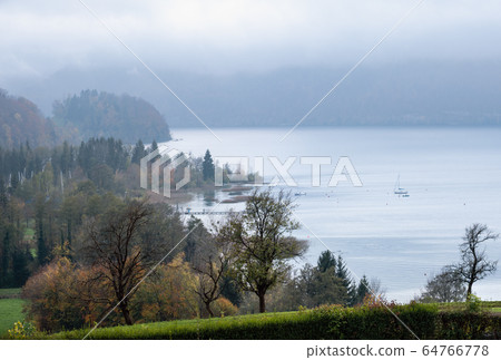 Autumn alpine lake Mondsee shore view from Autumn alpine lake Mondsee shore view from 64766778