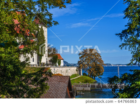Peaceful autumn alpine Traunsee lake and Peaceful autumn alpine Traunsee lake and 64766863