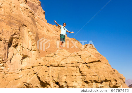 Man with open arms. Holy trip through the historic Man with open arms. Holy trip through the historic 64767473