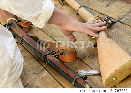 medieval weapons with a wooden butt lies on a medieval weapons with a wooden butt lies on a 64767881