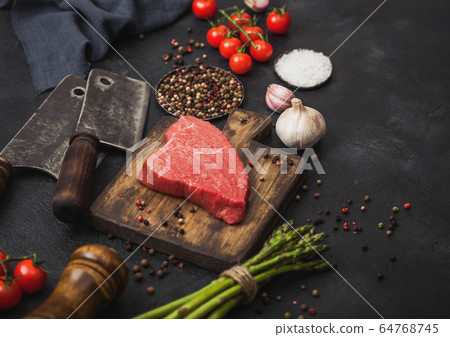 Slice of Raw Beef sirlion steak on wooden chopping 64768745