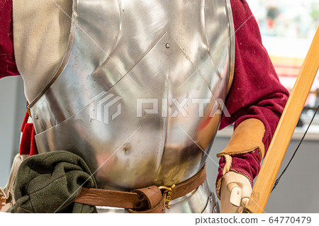 archer is dressed in an iron cuirass and a red archer is dressed in an iron cuirass and a red 64770479