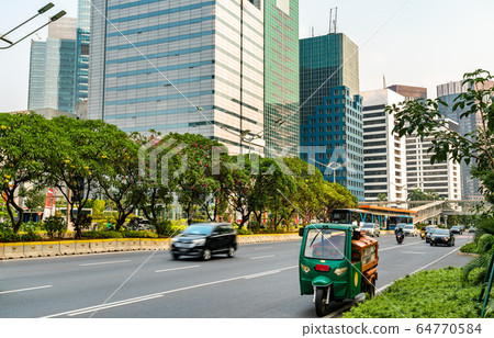 Tuk-Tuk at Jakarta Central Business District in Indonesia 64770584